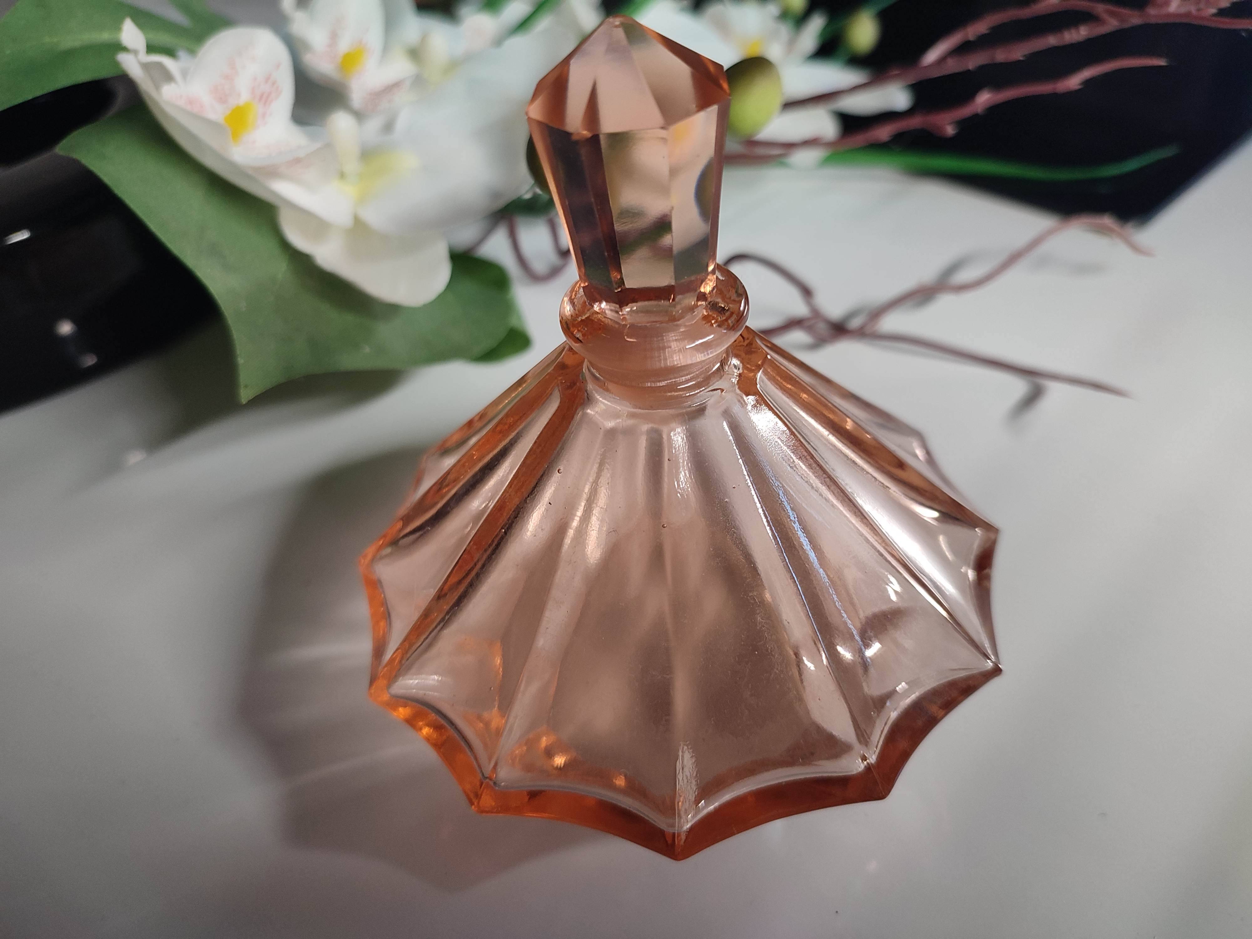 Vintage Art Deco perfume bottle in beautiful pink glass.