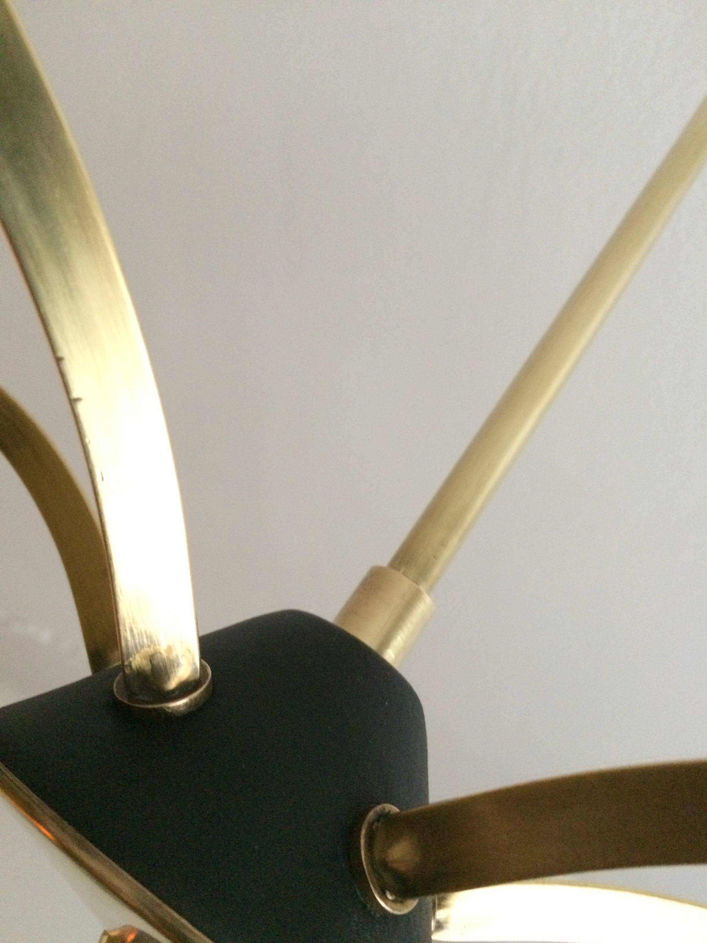 Lustre with 5 branches from the 1960s - 1970s in solid brass and black metal.