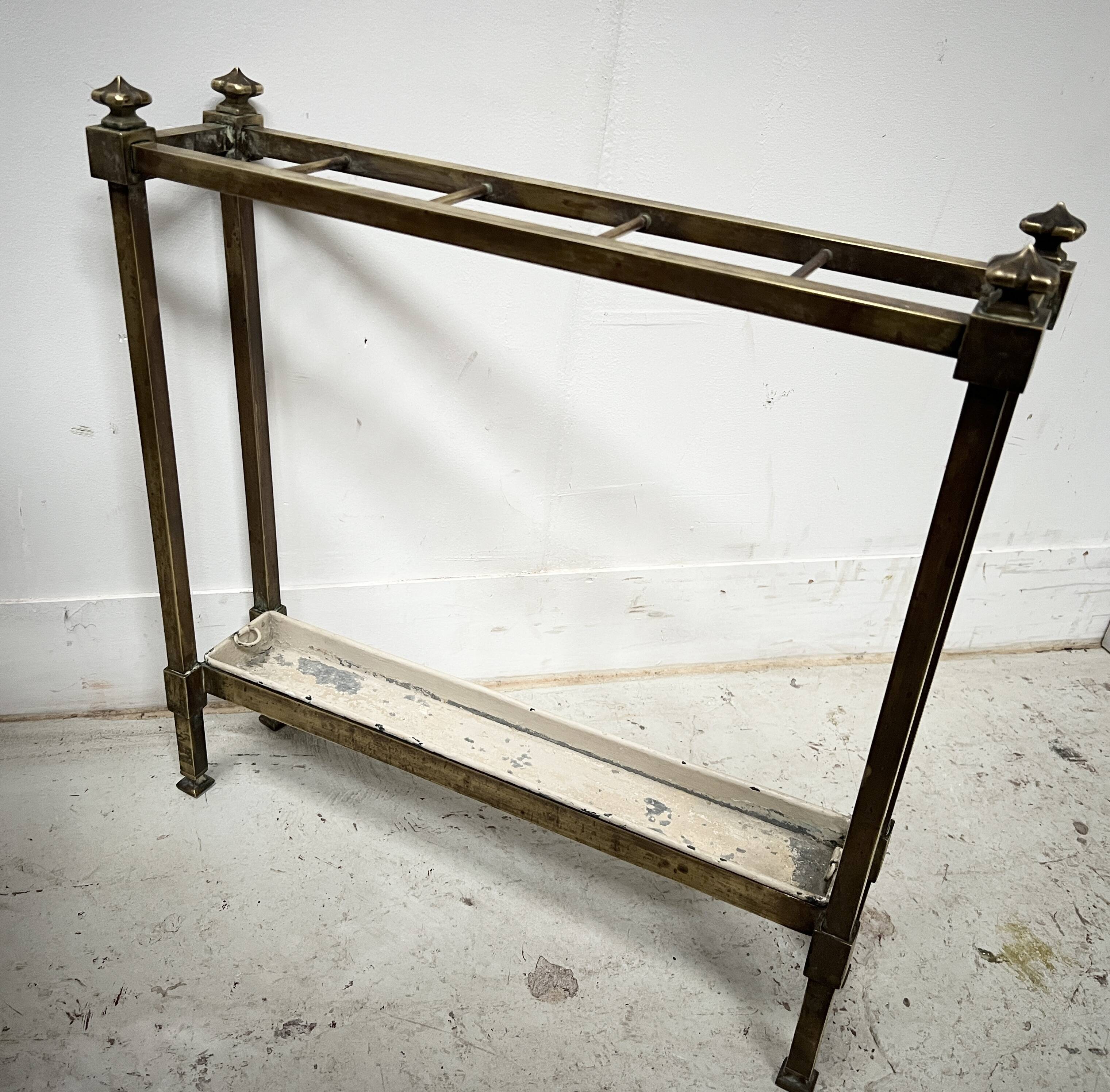 Brass and sheet metal umbrella stands from the 20th century.