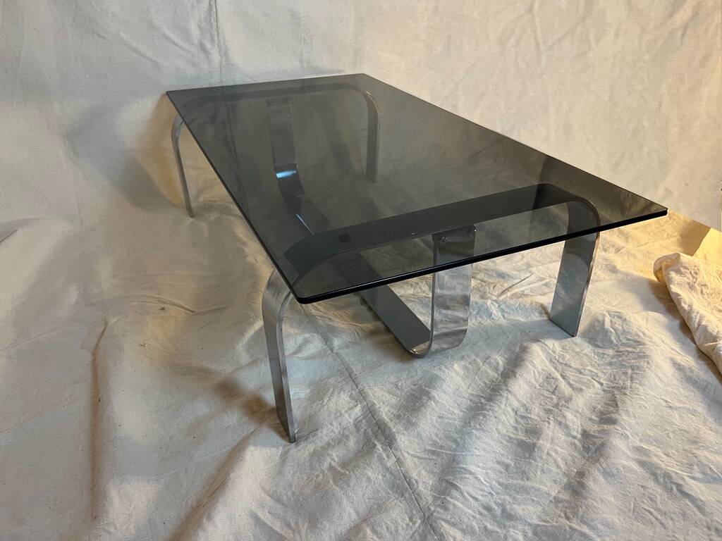 Vintage coffee table from the 70s in chrome and smoked glass, Space Age and Mid-Century style.