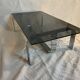 Vintage coffee table from the 70s in chrome and smoked glass, Space Age and Mid-Century style.