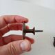 Pair of antique Empire furniture knobs from the 19th century.