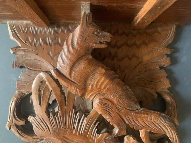 Black Forest carved wooden wall console, harness with wolf decoration