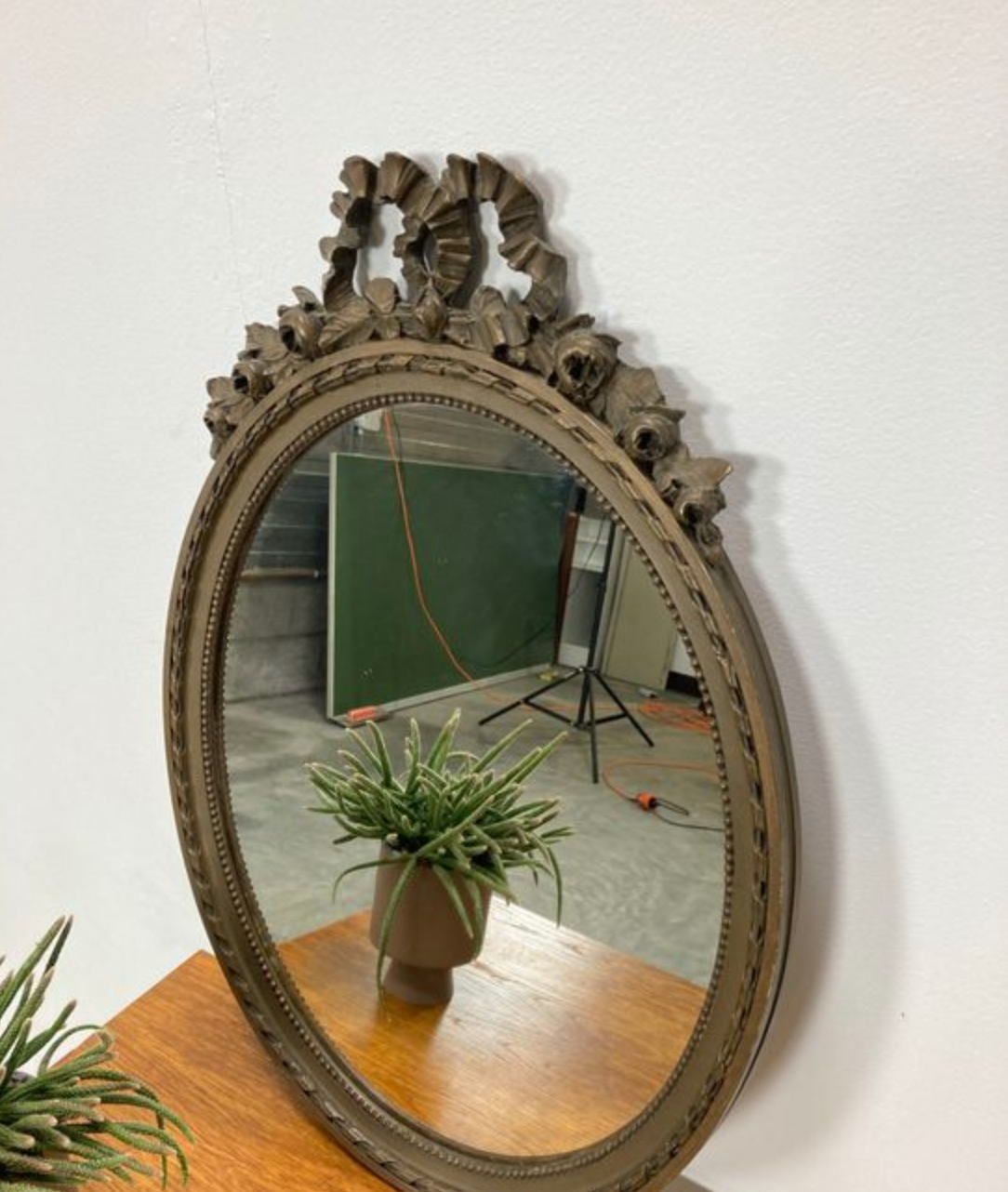 Vintage wooden mirror with arch and flowers