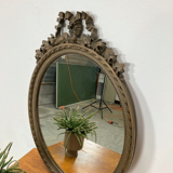 Vintage wooden mirror with arch and flowers