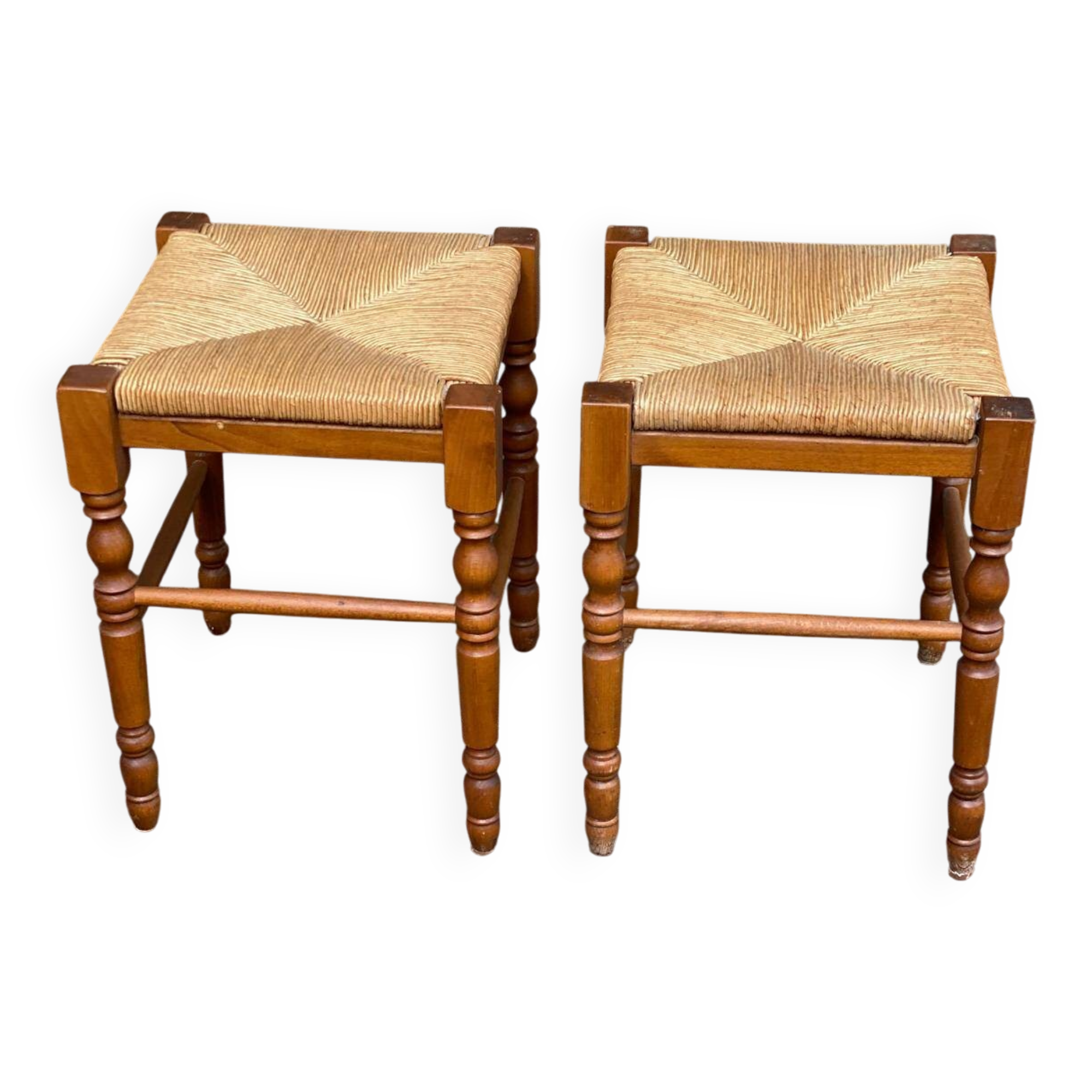2 square stools made of carved solid wood with rush seats from the 1970s.