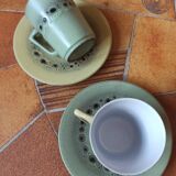 A pair of vintage glazed stoneware cups and saucers.