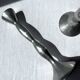 Pair of wavy aluminium candle holders