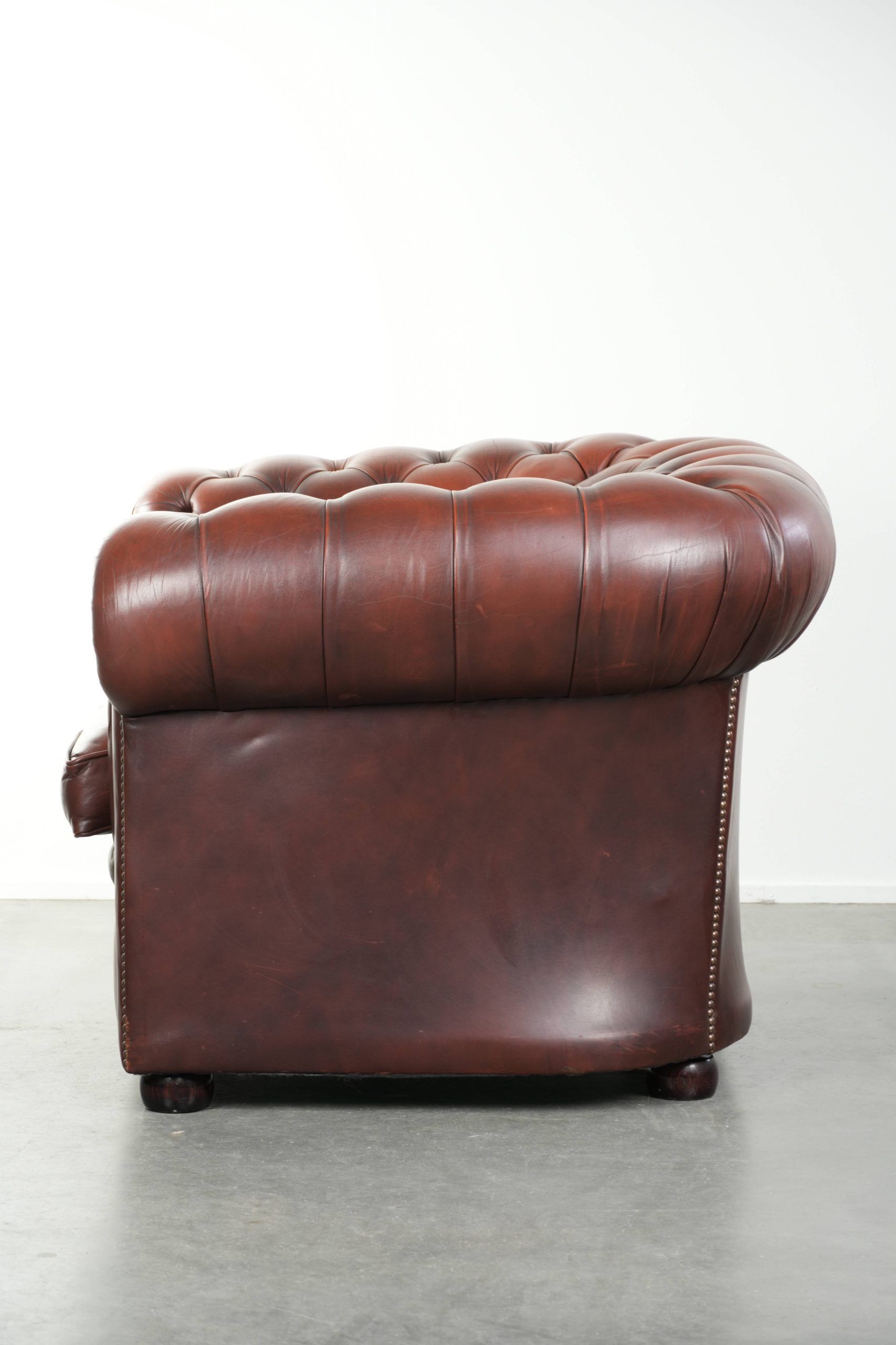 Cowhide Chesterfield armchair in a classic English style