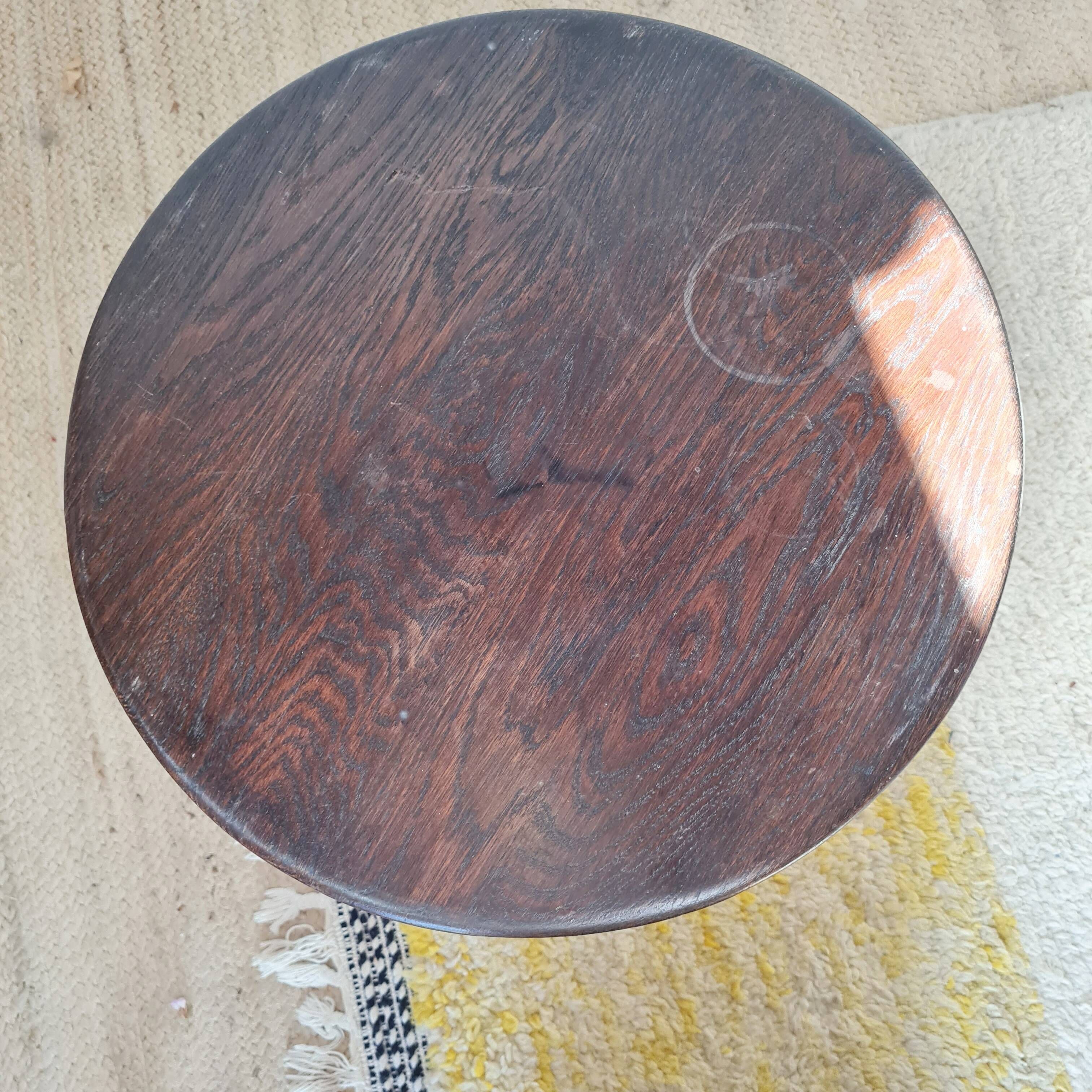 Vintage solid wood side table with curved legs.