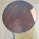 Vintage solid wood side table with curved legs.