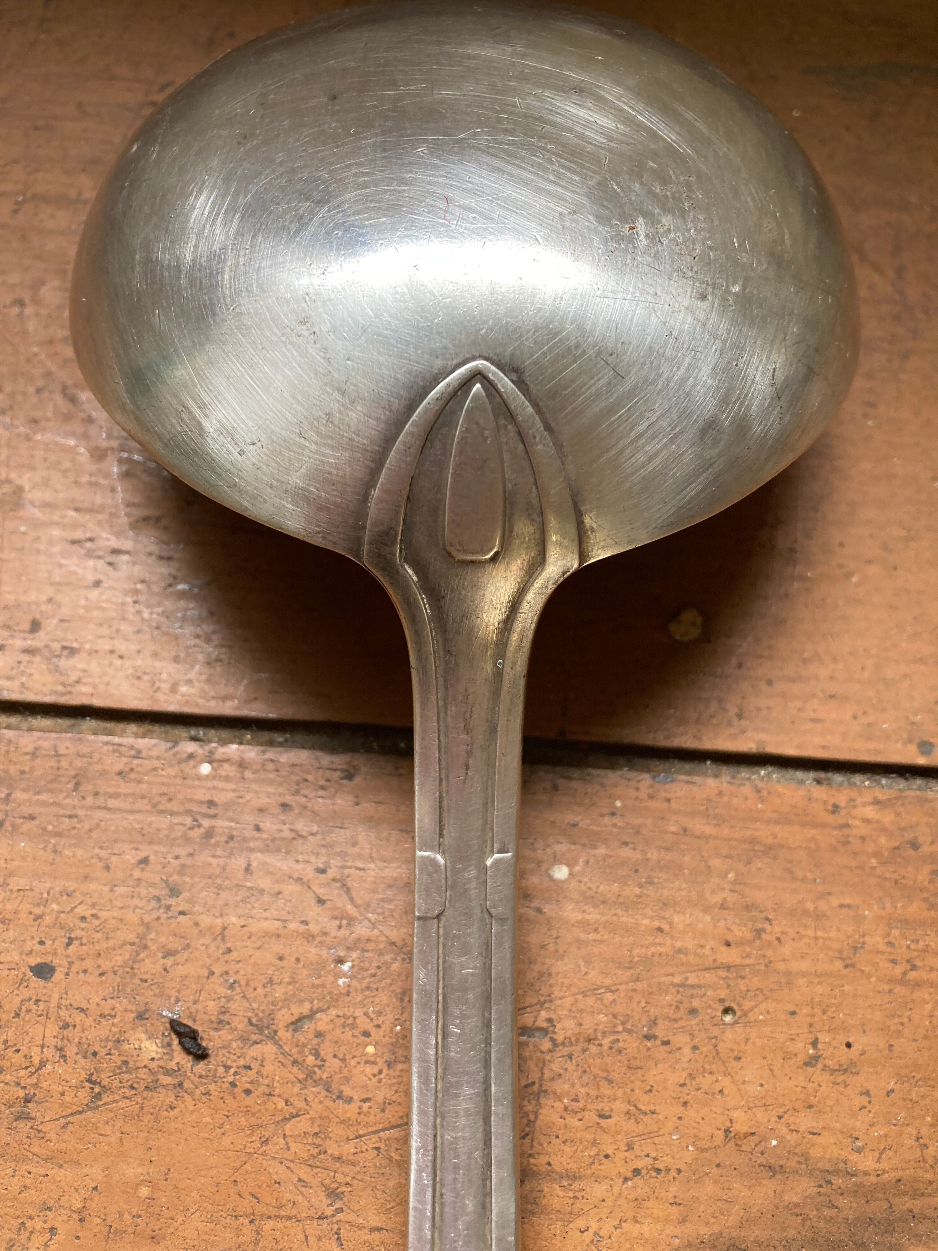 Old art deco ladle in silver metal Dixi