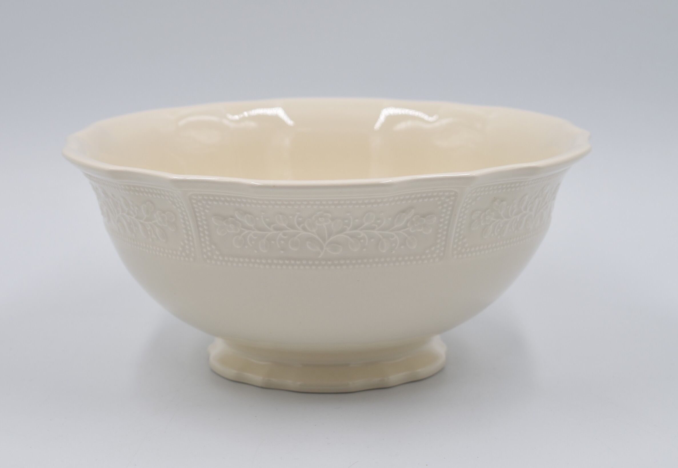Salad bowl in off-white earthenware ivory Lunéville decoration in relief France