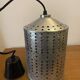 Industrial pendant lamp in perforated gray metal