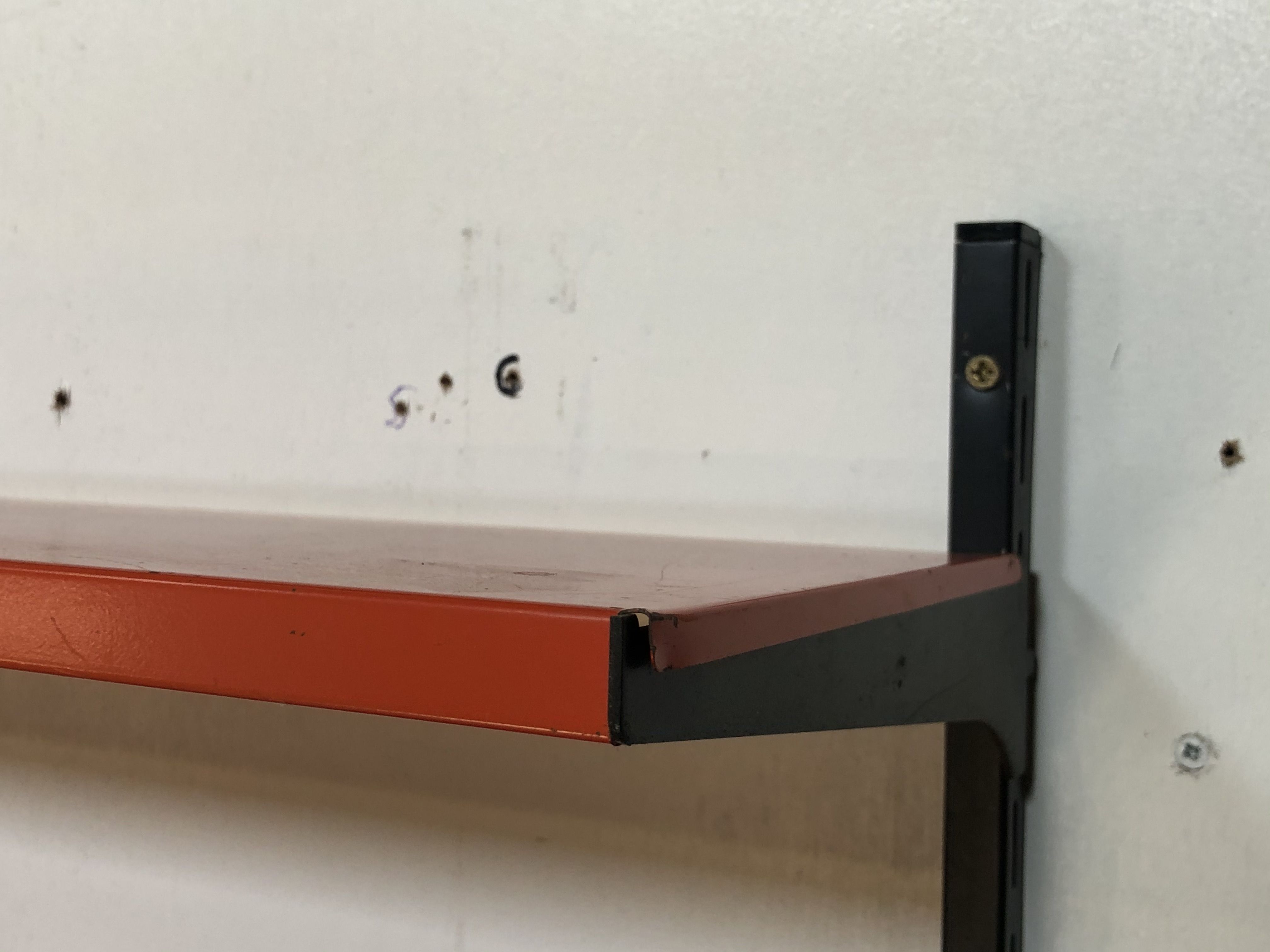 Tomado Holland vintage wall support black steel orange from the 1970s