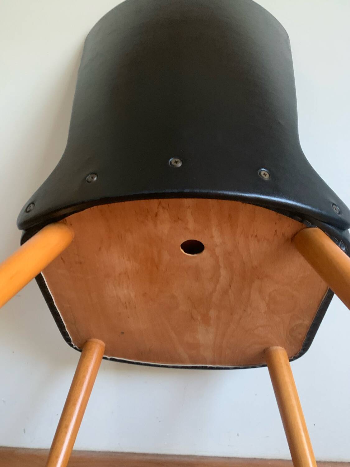Black chair with compass legs