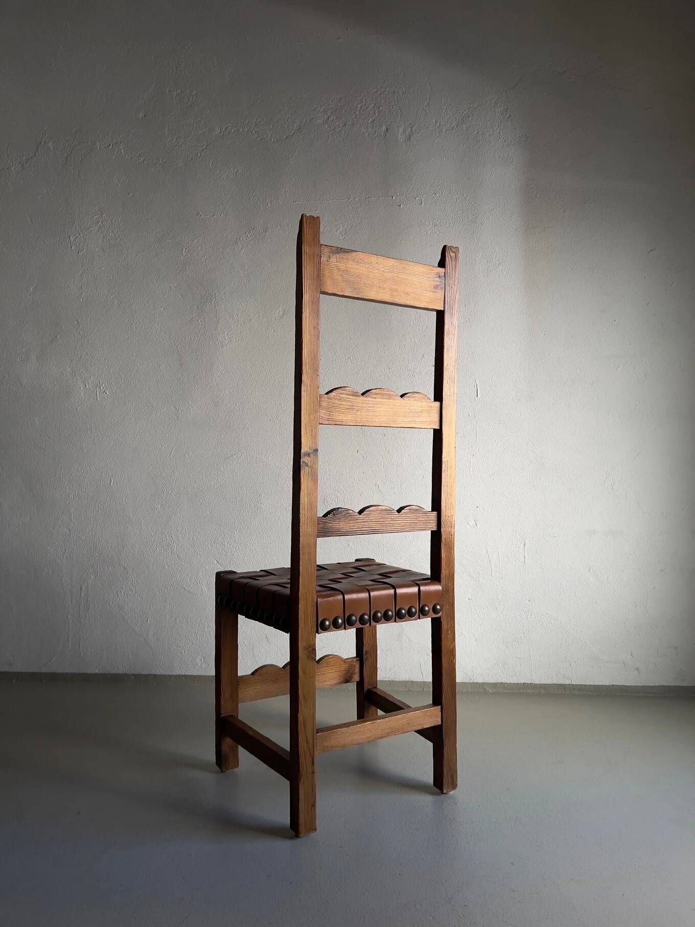 2 brutalist carved wood dining chairs with leather seat | The Netherlands | 1970s