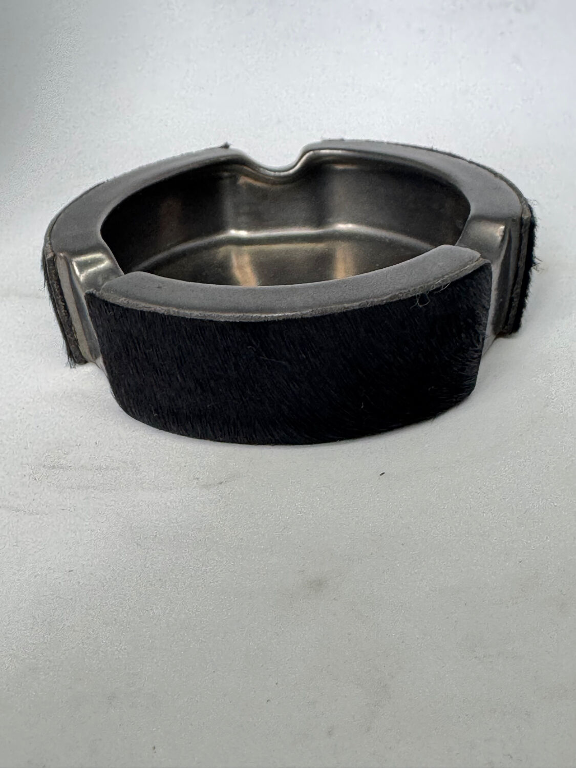 Vintage metal ashtray and hair