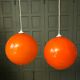 Pair of orange glass ball suspensions, 70s.