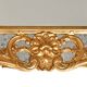 Console with a gilded wooden mirror.
