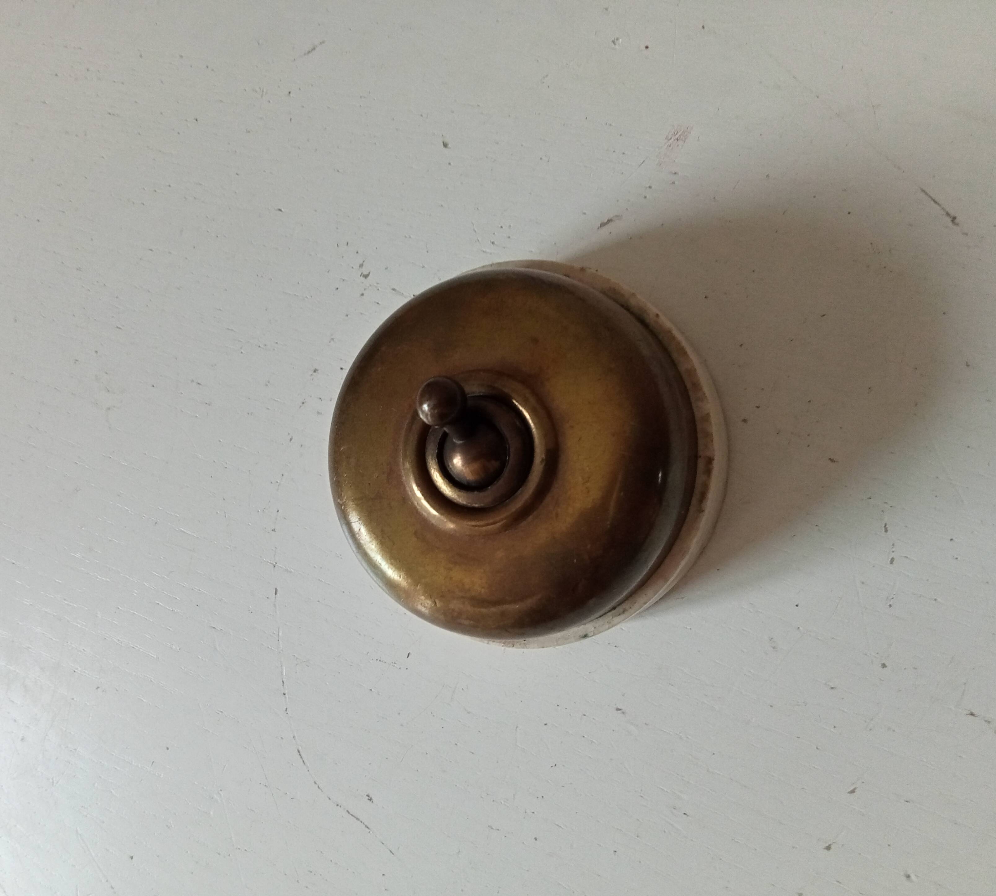 Antique brass and porcelain switch from the 40s/50s
