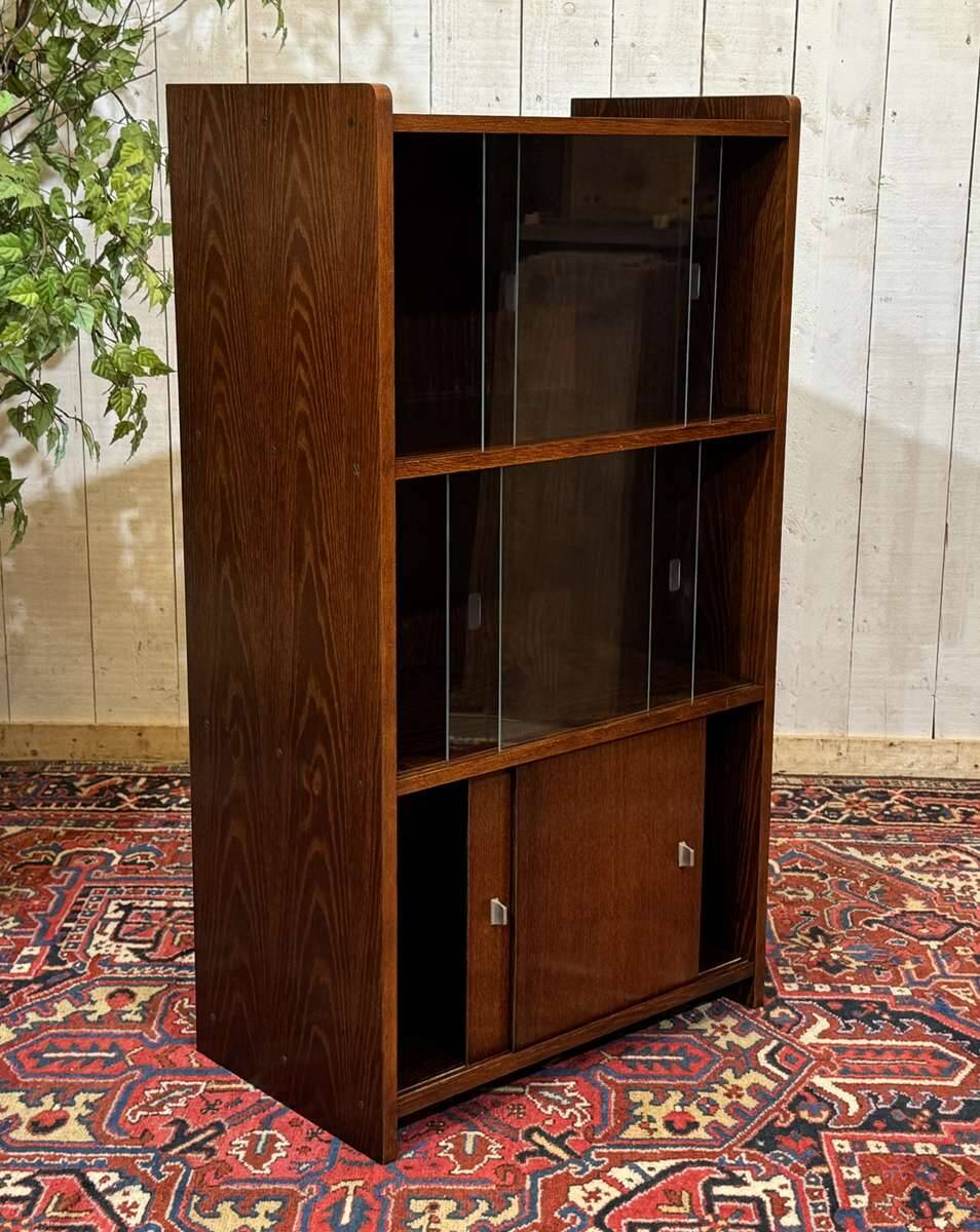 Small English oak library from the 1960s with sliding doors.