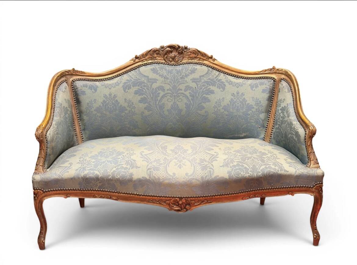 Wooden canapé, natural, formerly gilded in the Louis XV style.
