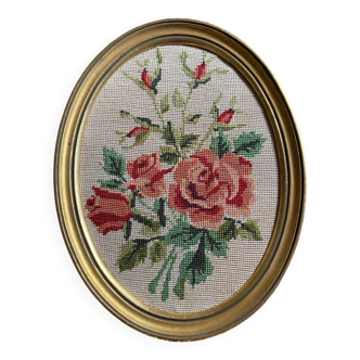 Oval frame tapestry bouquet of roses.
