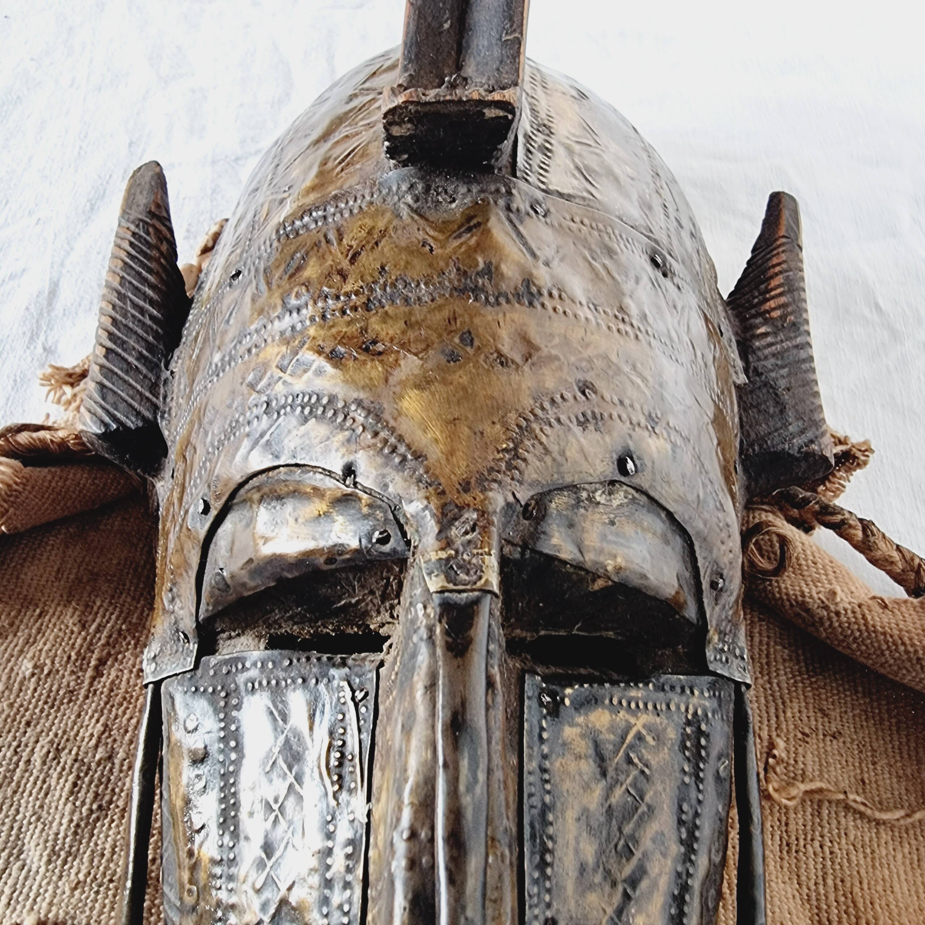 African mask from Mali from the N'Tomo tribe of Marka covered in chiseled brass