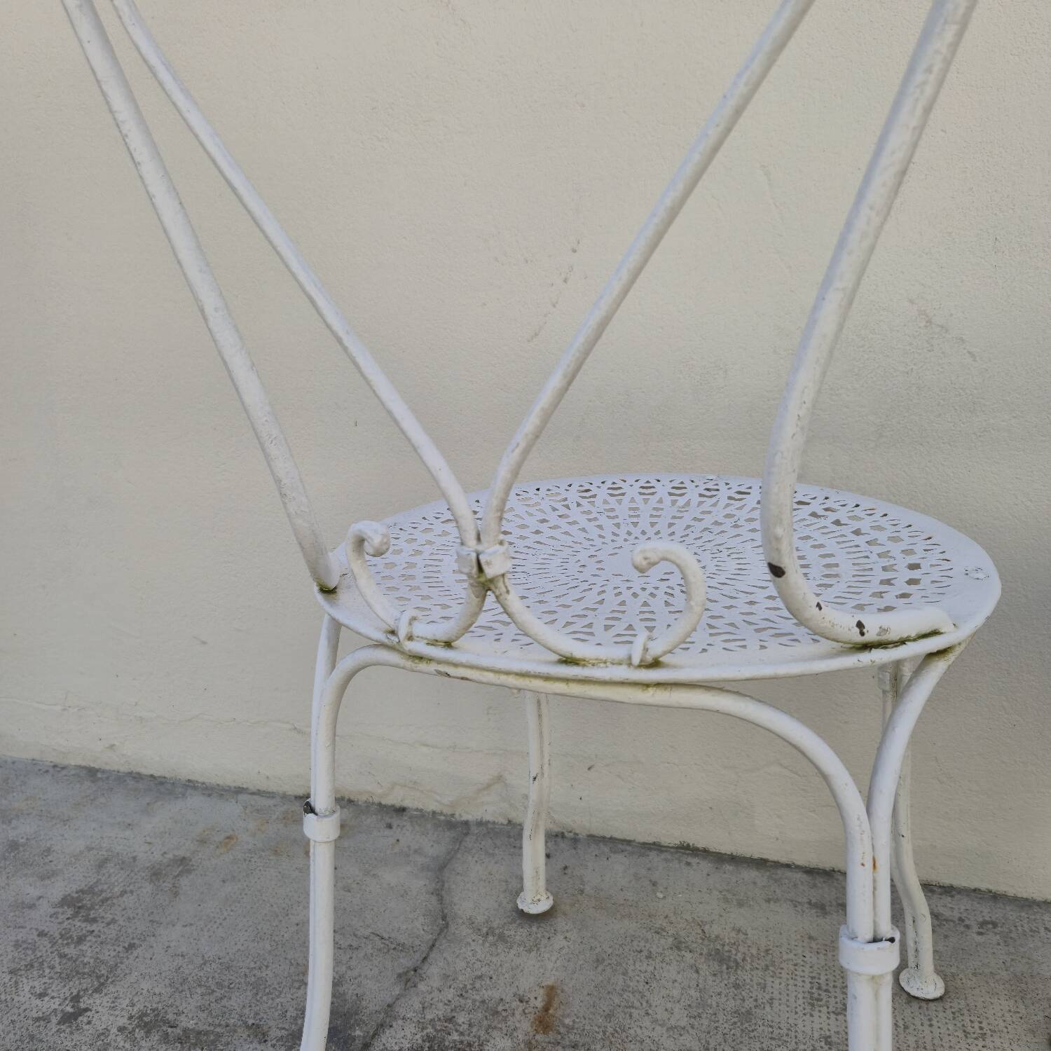 Pair of wrought iron garden chairs, antique manufacture