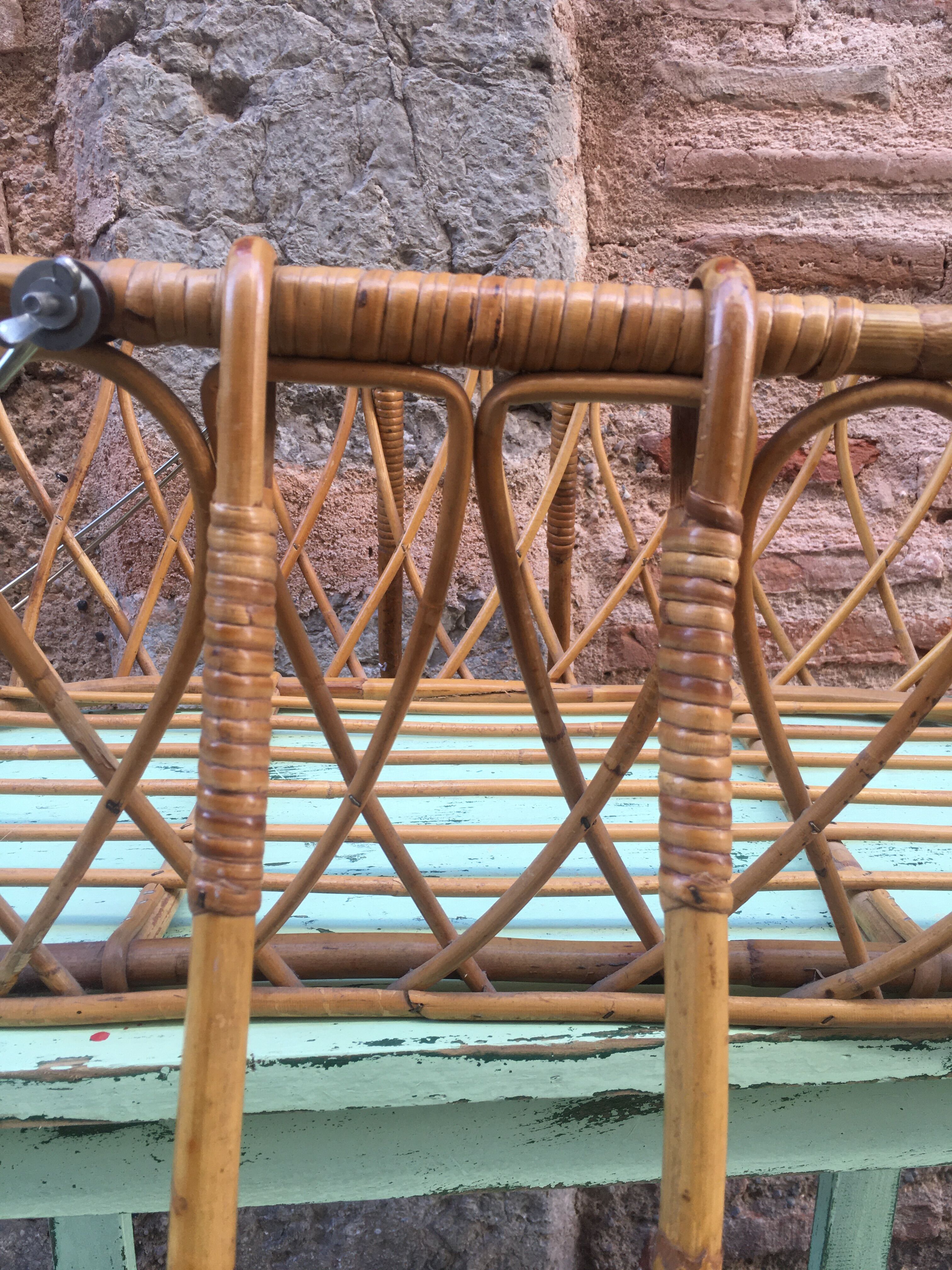 Rattan bassinet with hood arches