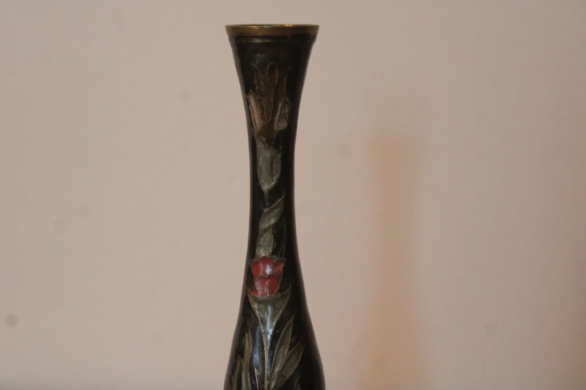 Vintage brass soliflore vase with black, red, and green floral decoration – H 18 cm