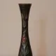 Vintage brass soliflore vase with black, red, and green floral decoration – H 18 cm