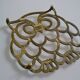 Vintage openwork brass trivet in the shape of an owl or owl