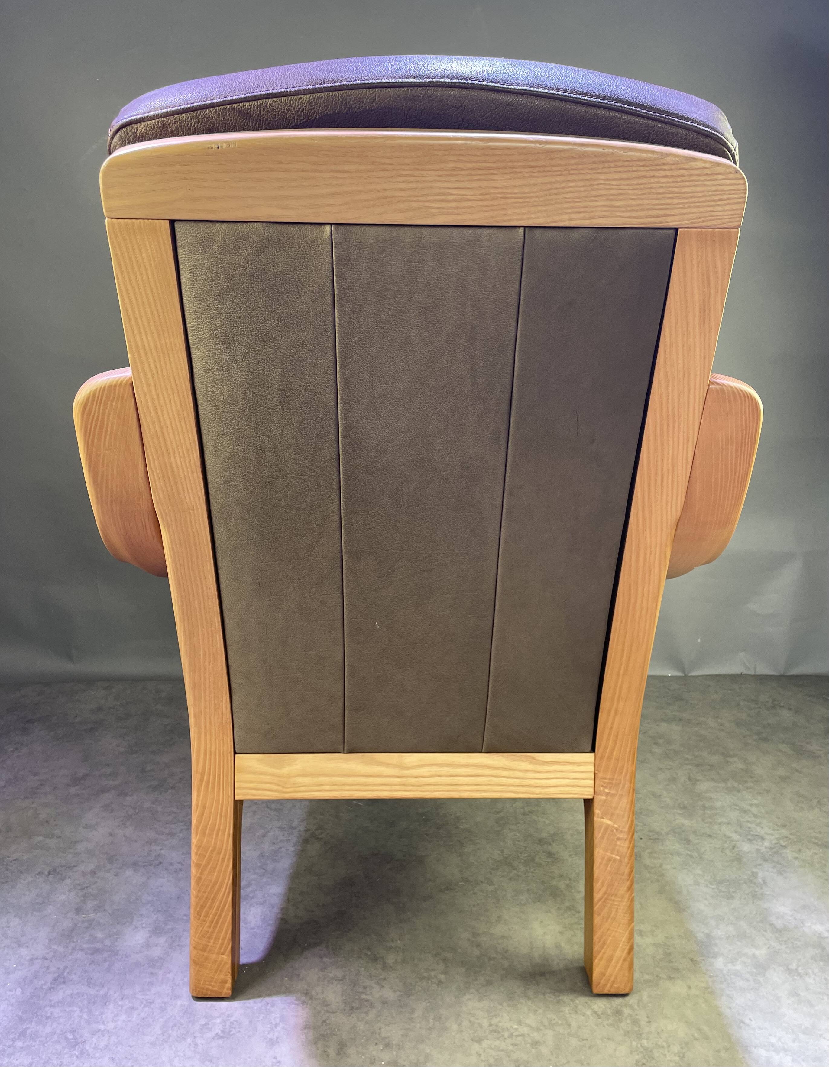 Chocolate leather armchair, wooden structure