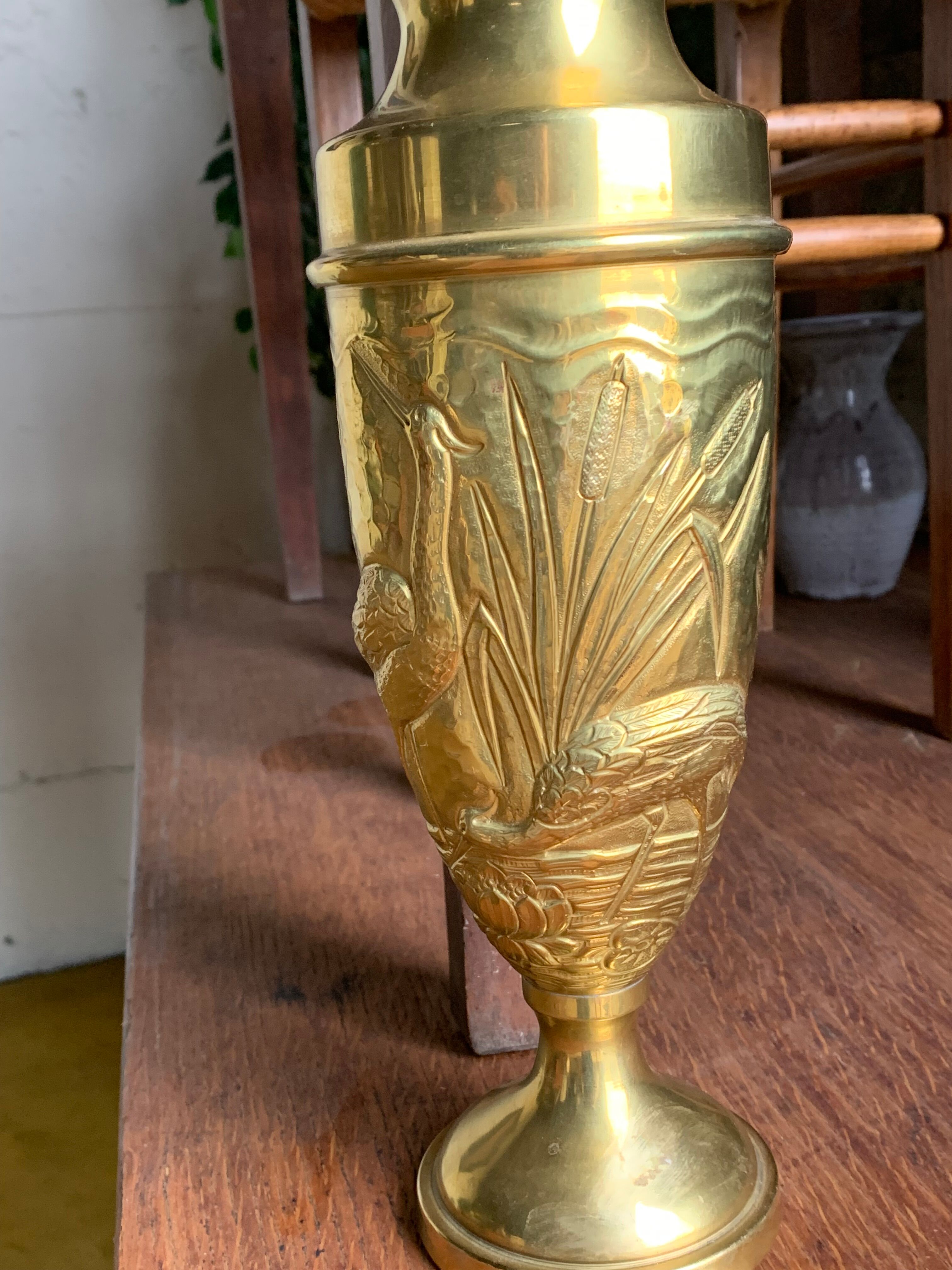 Brass vase with crane decoration