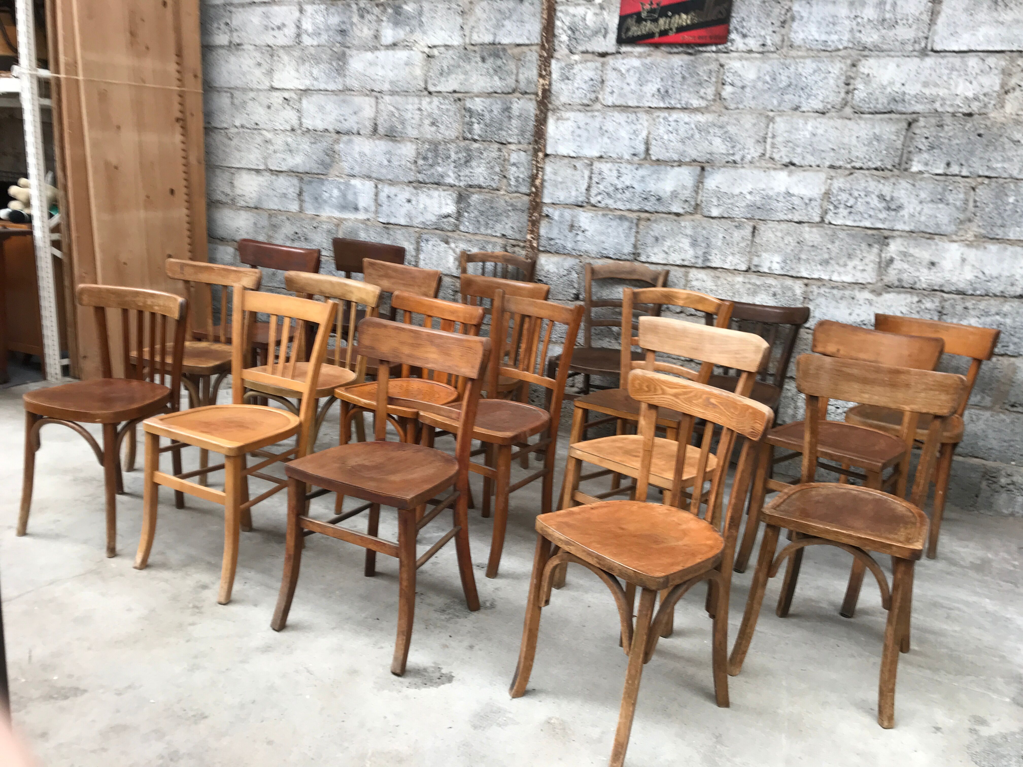 Set of 15 mismatched curved wood bistro chairs