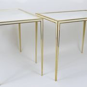 A pair of brass and white mirror tables from Vereinigte Werkstätten, Germany, 1970s.