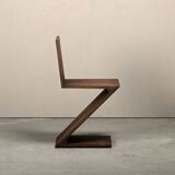 Gerrit Rietveld Zig Zag Chair is dark brown stained wood