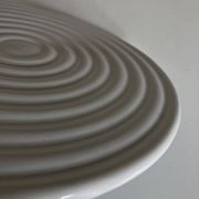 White glazed earthenware potter's trivet