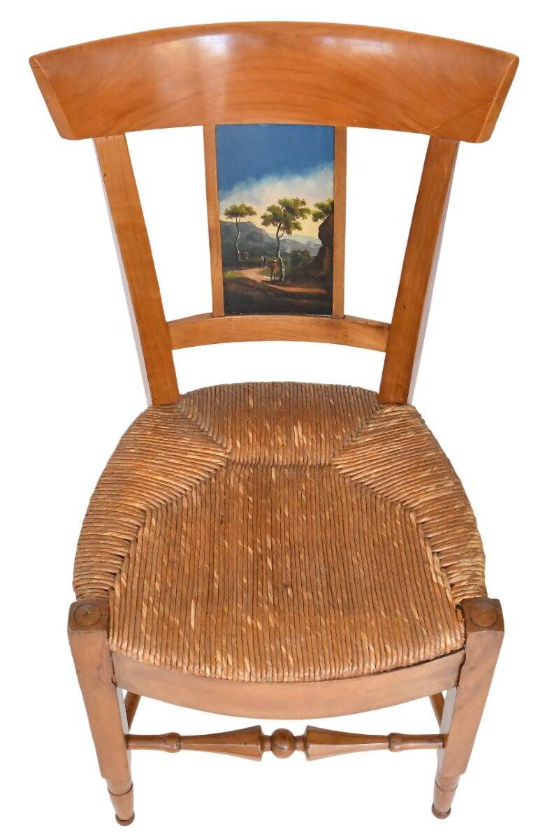 Pair of chairs with slatted backs and painted bands depicting animated landscapes.