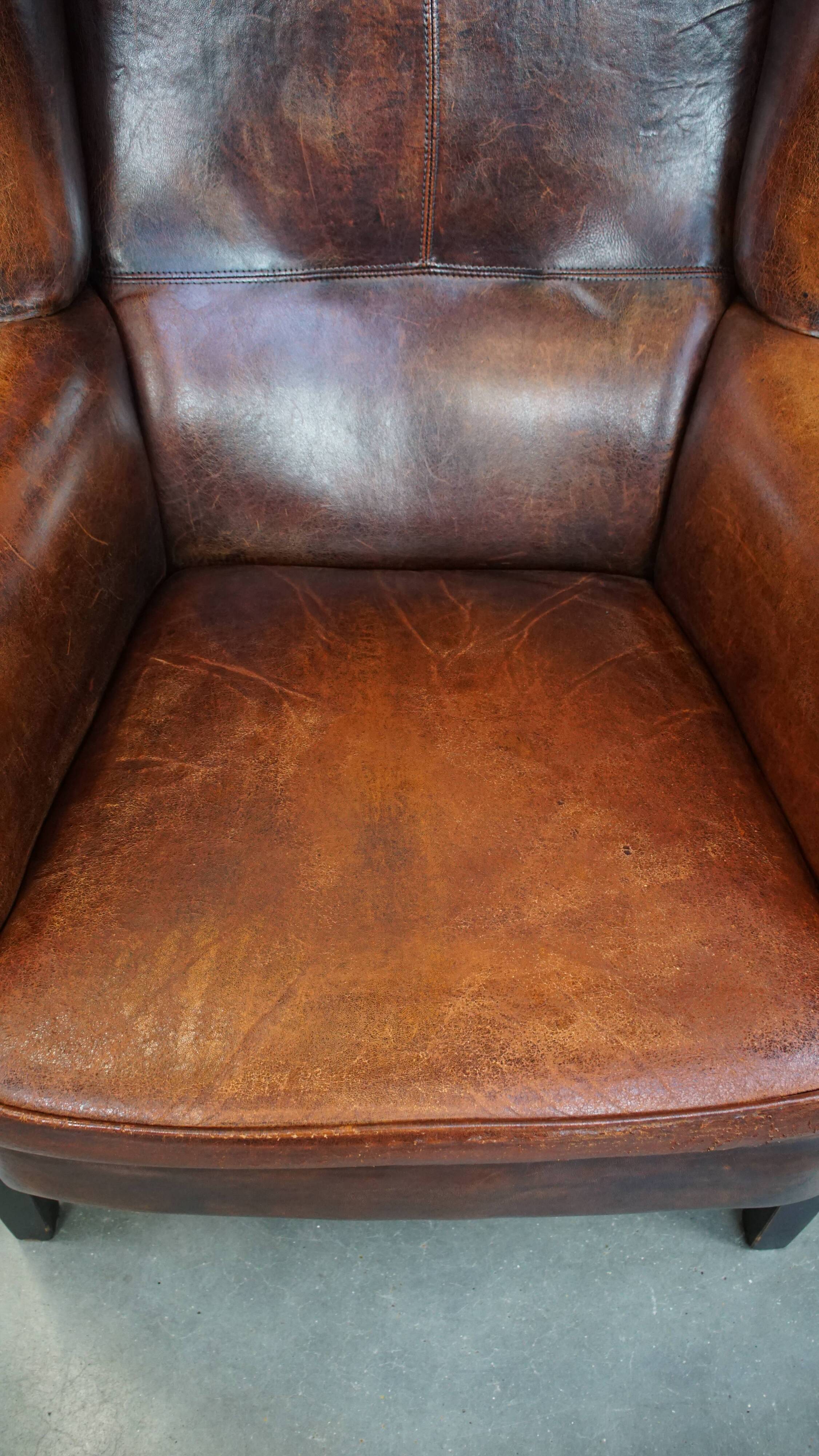 Vintage sheep leather wingback chair