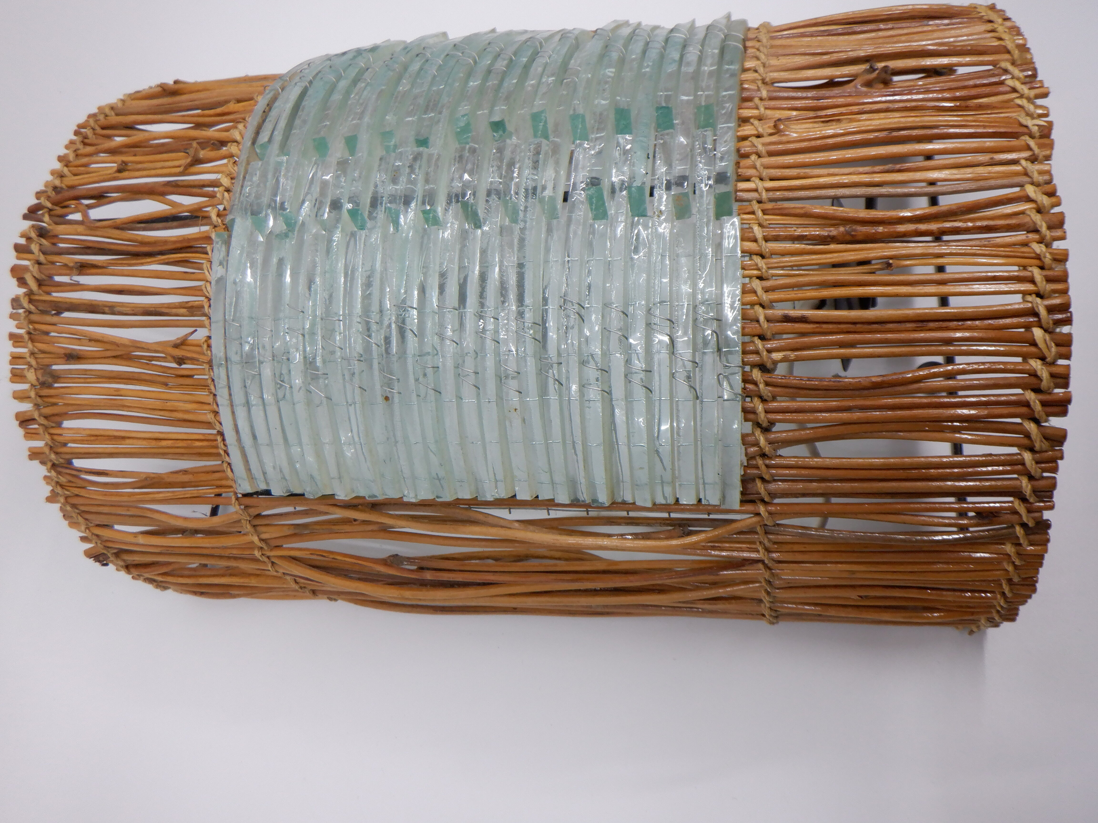 Glass and rattan sconce