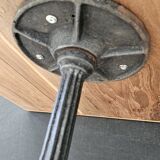 Bistro table with cast iron base and teak top