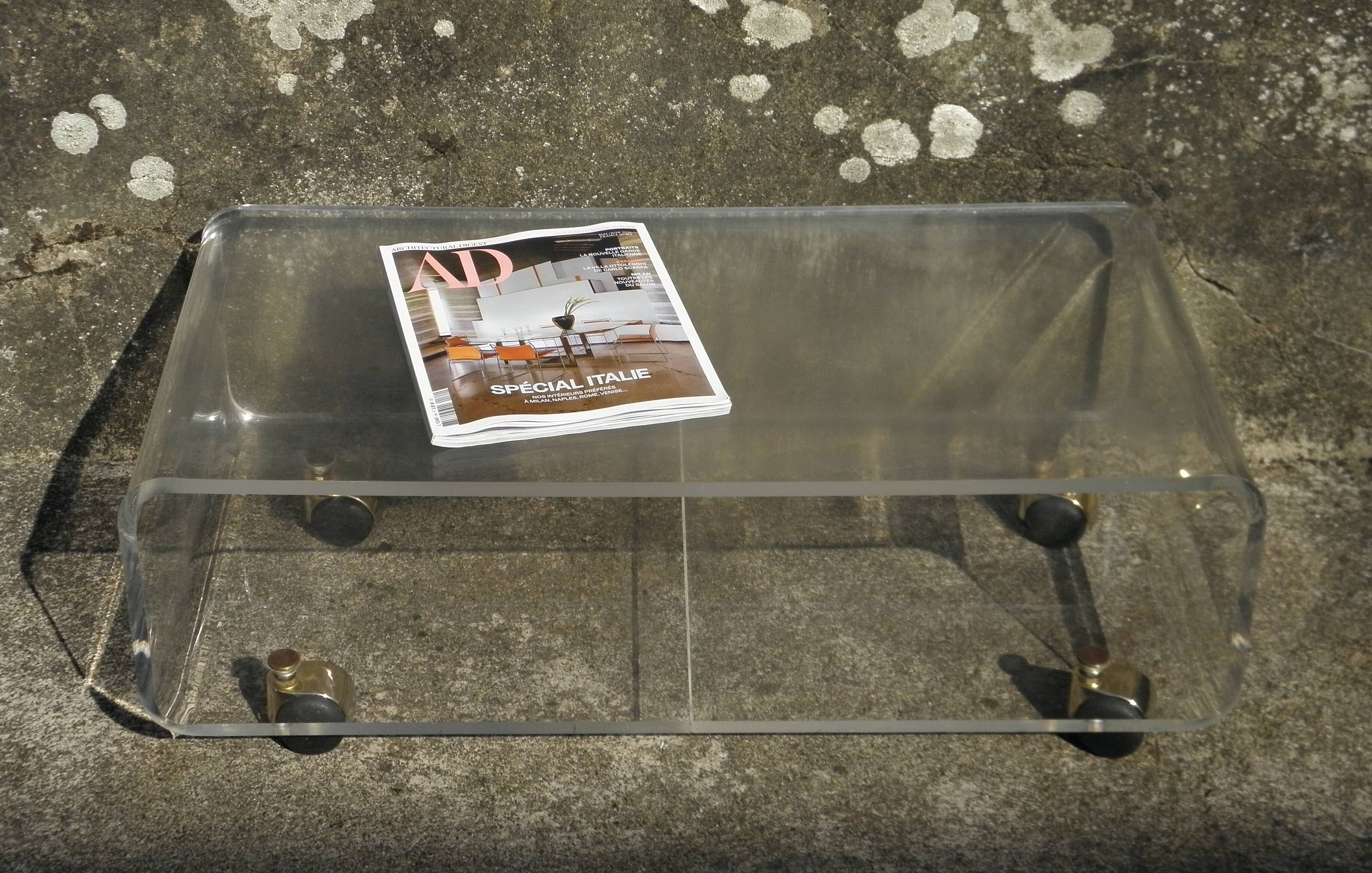 Plexiglass coffee table on wheels