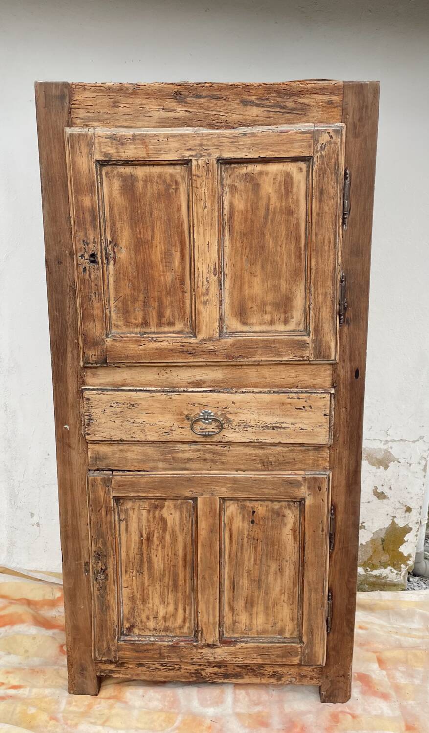 Rustic and vintage wardrobe in raw wood, wabi-sabi style.