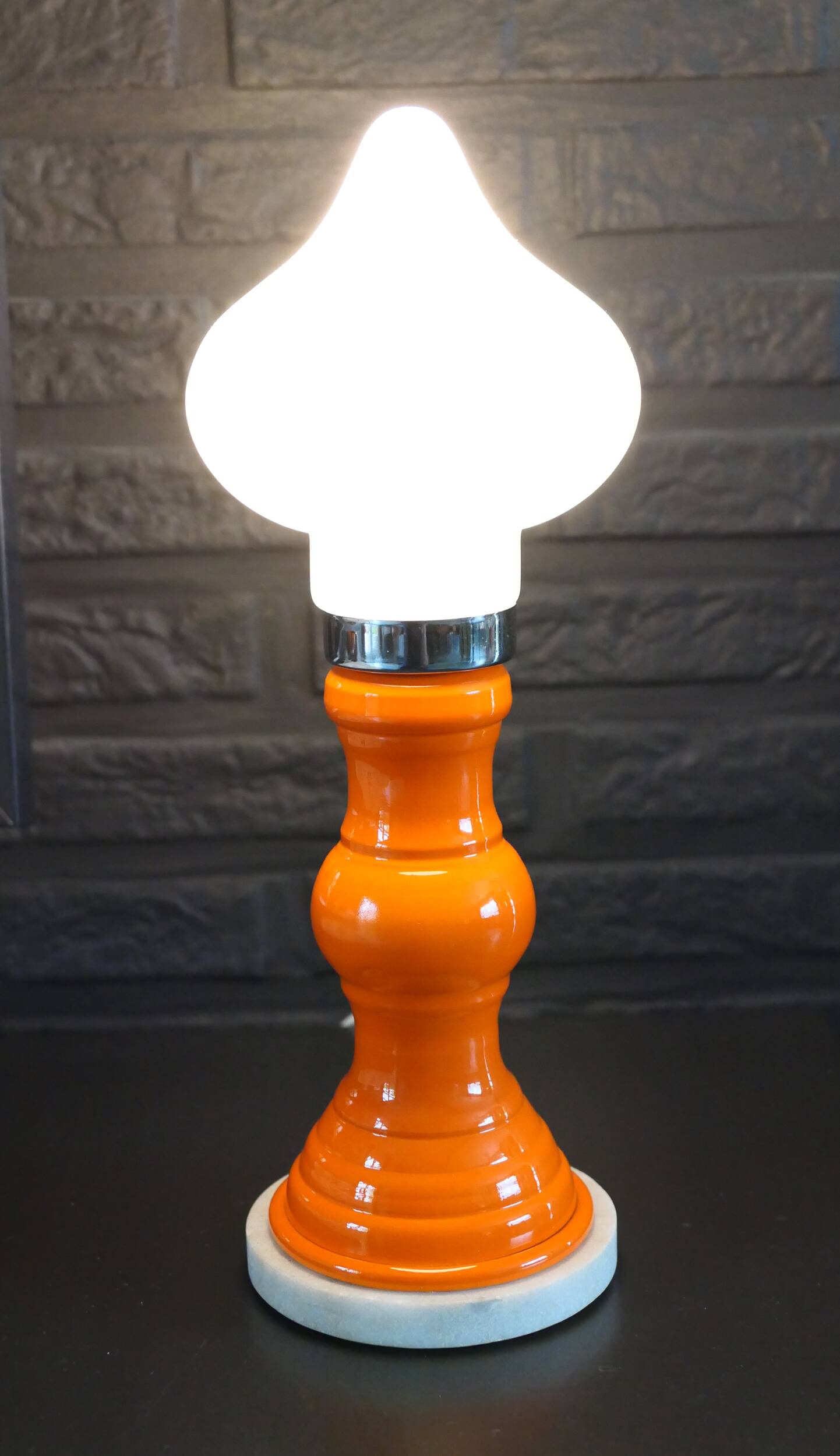 Table lamp or bedside lamp from the 1960s-70s in orange and chrome.