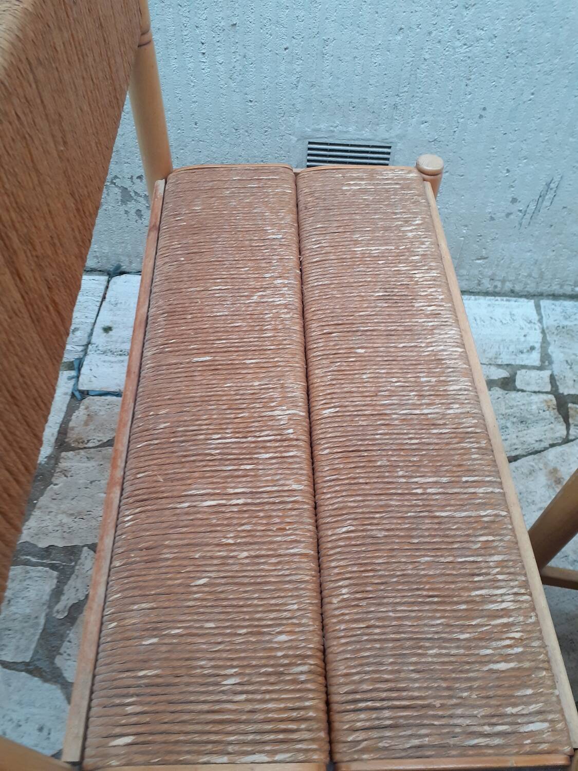 2 wooden and straw benches