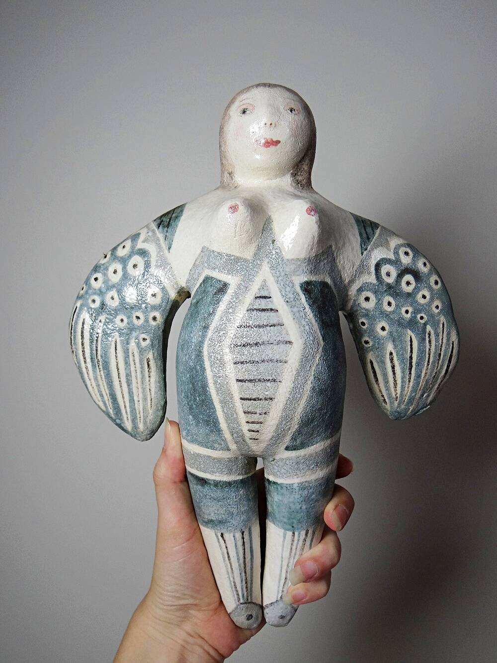 Vintage stylised mermaid ceramic wall sculpture from an art studio.