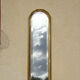 Vertical mirror, gold frame with beading.